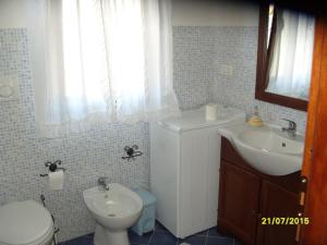 1CASADELFARO con Giardino a Pittulongu 600Metri dalla Spiaggia