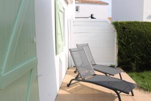 Maisons de vacances Maison Les Embruns avec piscine collective : photos des chambres