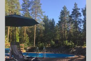 Sirpas Artistic Nuuksio Retreat with Heated Pool