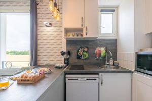 Appartements LYS - 7 Min des parcs Walt Disney- Parfait pour les familles- Arrivee Autonome - Parking & Wifi Gratuit : photos des chambres