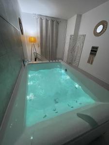 Appartements Le Chateaucreux - Cosy & SPA : photos des chambres