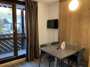 Appartements travelski home classic - Residence La Muzelle : photos des chambres