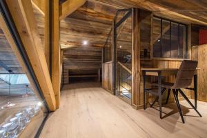 Chalets CAPRICORNE - Chalet sur les pistes avec sauna et home cinema : photos des chambres