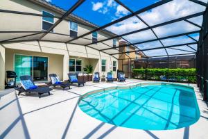 Stunning Lake View from South Facing Extended Pool Deck with Games Room on Gated Solterra Resort