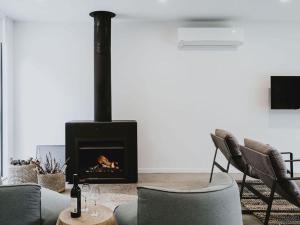 Lithic House -wood fire and bush views