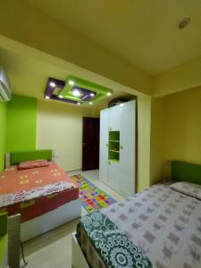 شقه سوبر لوكس دور ارضى بجنينه بالمعموره الشاطى lovely apartment at Mamora beach مع كارنيهات شاطى خاص