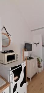 Appartements Charmante maisonnette : photos des chambres