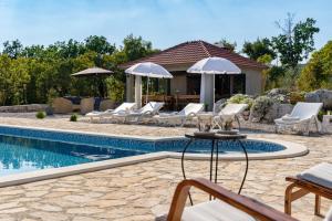 Villa Lugareva with 52 sqm private pool, 4 bedrooms, 4 bathrooms, summer kitchen, traditional environment, playground