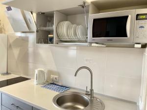 Green apartments on Kotsyubinsky Avenue