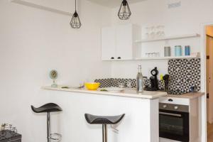 Appartements L'ESCALE - TOPDESTINATION-BOURG - Centre ville - Classe 3 etoiles : photos des chambres