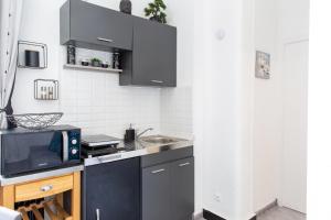 Appartements Studio en centre ville a 10 mn a pied de la gare : photos des chambres