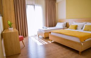 Triple Room with Balcony room in Airport Garden Hotel