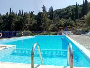 KAMINAKIA Apartments - Adults only policy - Delve into this little oasis where peace and quiet reign supreme - Sheltered by an evergreen cypress forest - Offering a large swimming pool exclusively for guests' use and breathtaking sea views from every room - Tselendáta