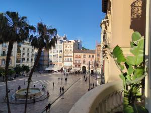Historic 19th-Century Apartment with Balcony Overlooking Plaza