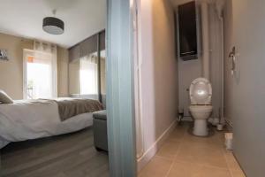 Appartements LA COMMANDERIE JARDIN PARKING Home-One : photos des chambres
