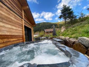 Les Chalets Perce Neige & Jacuzzi privatif, proximite Gerardmer & La Bresse : photos des chambres