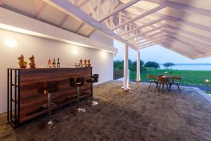 StayVistas Eva Villa - Lakeside Luxury with Modern Decor, Pool & Expansive Lawn - Near Sula