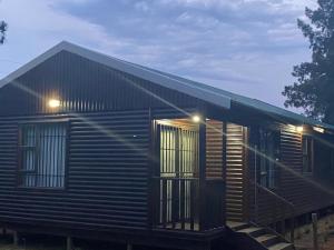 Man and Dog Log Cabin