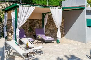 stone house Nikolina with heated Pool