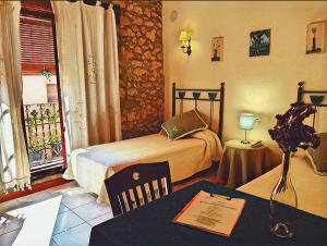Twin Room with Balcony room in Hotel Rural Via Natura