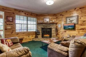 Sunset Ridge Cabin - A Romantic Smoky Mountain Escape or Family Getaway with Privacy - behind Dollywood, large game room, jacuzzi tub, fire pit, large wrap-around deck, and more