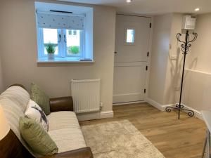 The Nook at Pentregaer Ucha, with tennis court & lake.