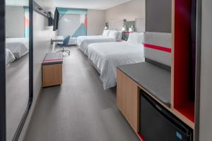 Standard Queen Room with Two Queen Beds room in avid hotels Milwaukee West - Waukesha an IHG Hotel