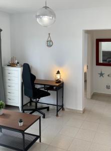 Cozy and sunny apartment over the rooftops