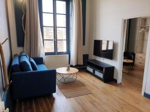 Appartements Meubles de l'Arsenal coeur de ville ! : photos des chambres