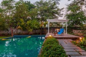 Morning Dew Retreat by StayVista - Modern interiors, Indoor games, Lush greenery, Pool & Gazebo await your escape