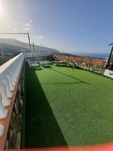Tenerife apartment 100m2 CASA DE DON QUIJOTE with a terrace of 100m2 with a view of the ocean and Teide volcano and a garden of 600m2