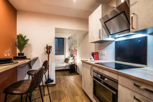 Appartements NOUVEAU - L'Atelier - Centre Ville : photos des chambres