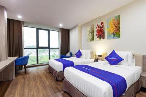 Phòng Hai Giường Đơn Loại Sang (Deluxe Twin Room)