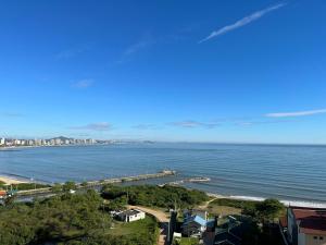 Apartamento novo frente mar com piscina em Home Club