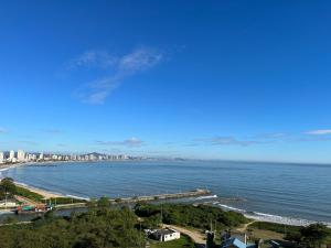 Apartamento novo frente mar com piscina em Home Club