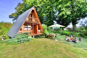 Holiday home in Osieki near a lake