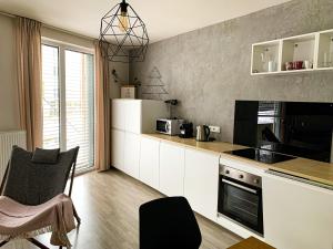 Jezerní apartmán s terasou a saunou v Lakepark Residence