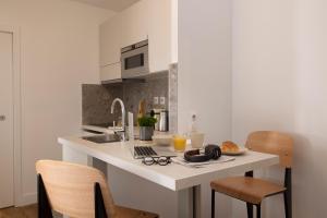 Appartements Yuna Blanche - Serviced Apartments : photos des chambres