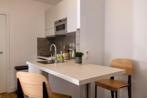 Appartements Yuna Blanche - Serviced Apartments : photos des chambres