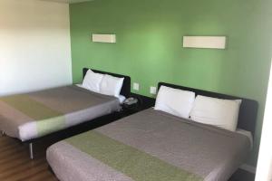 Queen Room with Two Queen Beds Hot Tub - Accessible room in Motel 6-Barstow CA