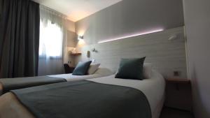 Hotels Kyriad Montpellier Sud - A709 : photos des chambres