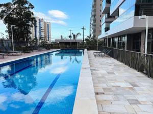 Home 49 I Apto pé na areia e piscina aquecida em Bertioga