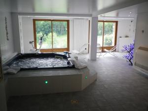 Appartements Chalet Beausoleil 4 etoiles - jacuzzi - au pied du Col de la Croix de Fer : photos des chambres