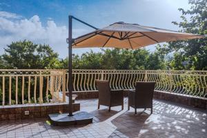 SaffronStays Aura - 4BR luxury pool villa with gym, BBQ deck, lawns & indoor games near Kihim Beach