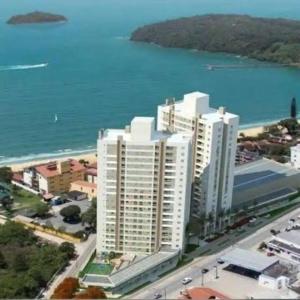 Apartamento novo frente mar com piscina em Home Club