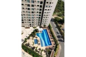 Apartamento novo frente mar com piscina em Home Club