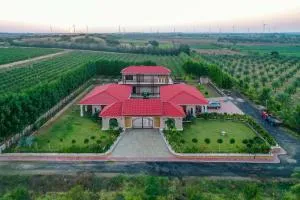 Desert Palms by StayVista in Kutch, nestled in orchards, features a swimming pool and a scenic balcony for a serene getaway - Dholovira