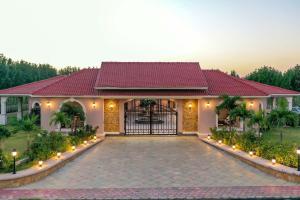 Desert Palms by StayVista in Kutch, nestled in orchards, features a swimming pool and a scenic balcony for a serene getaway