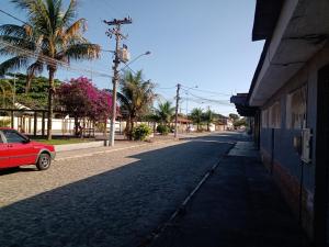 Casa conceito aberto aconchegante, perto de tudo e com garagem 64m2