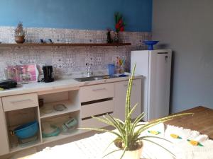 Casa conceito aberto aconchegante, perto de tudo e com garagem 64m2